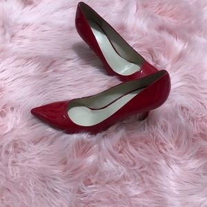 Red patent leather pumps